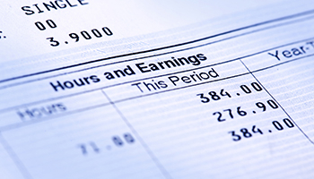 Close up of an earnings statement